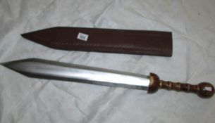 A replica sword in scabbard.