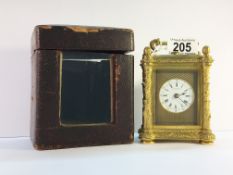 A Hunt and Roskell brass repeater carriage clock in original case.