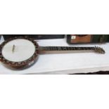 A 19th century "The Windsor" banjo with inlaid back.