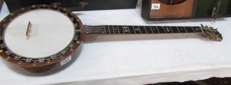 A 19th century "The Windsor" banjo with inlaid back.
