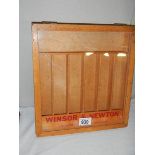 A Windsor & Newton brushes display case.