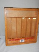 A Windsor & Newton brushes display case.