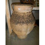 A large Grecian style garden pot.