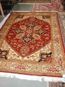 A red ground heriz rug, 230 x 160 cm.