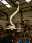 Taxidermy - a cobra on stand.