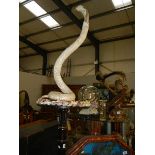 Taxidermy - a cobra on stand.