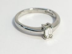 An 18ct white gold and diamond solitaire ring, size M.