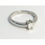 An 18ct white gold and diamond solitaire ring, size M.