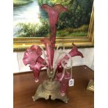 A mis-matched Victorian cranberry glass epergne on metal base.