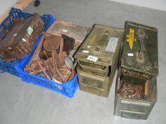 2 ammunition tins, a quantity of cast iron shoe lasts, tools etc.