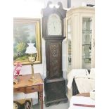 A heavily carved 30 hour Grandfather clock, W Bowers, Chesterfield. in working order.