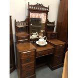 A mahogany mirror backed dressing table.