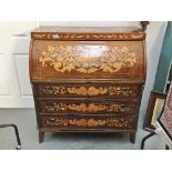 A Dutch marquetry tambour front desk.