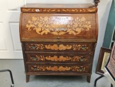 A Dutch marquetry tambour front desk.