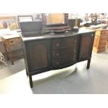 A mahogany 2 door sideboard with 3 central drawers.