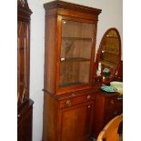 A mahogany glazed top bookcase.