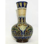 A 1881 Doulton Lambeth vase with narrow neck.