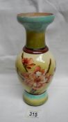 A Doulton Faience vase depicting flowers by Minna Crawley (1878-85) assisted by Alice Campbell with