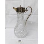 A superb quality cut glass claret jug with silver top and handle.