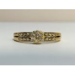 A9ct gold and diamond cluster ring, size M.