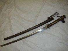 A rare Japanese Samurai sword in sheath bearing Japanese characters Miru Toshiharu.