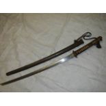 A rare Japanese Samurai sword in sheath bearing Japanese characters Miru Toshiharu.