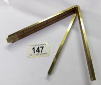 A Stanley No.62 1/2 24" brass and wood folding ruler.