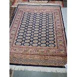 A blue ground bokhara rug, 190 x 140 cm.