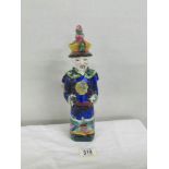 An early Chinese figure of an 'Official", impressed mark on base, approximately 29 cm tall.