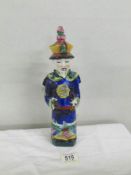 An early Chinese figure of an 'Official", impressed mark on base, approximately 29 cm tall.