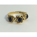 A 9ct gold ring set with 3 mood stone, hall marked NC, Sheffield, 1992, Size L.