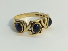 A 9ct gold ring set with 3 mood stone, hall marked NC, Sheffield, 1992, Size L.