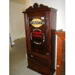 A 'Mayo's smoking - chewing tobacco' advertising cabinet.