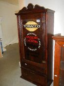 A 'Mayo's smoking - chewing tobacco' advertising cabinet.