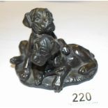 A 20th century bronze boxer puppies group.