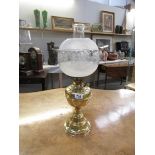 An Edwardian all brass oil lamp with twin wick burner,