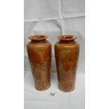 A pair of Royal Doulton leaf patterned vases (approximately 11" tall) in browns, creams and blue,