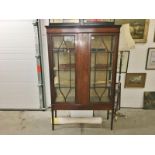 An Edwardian mahogany astragal glazed display cabinet