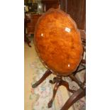 An Edwardian mahogany tripod tea table with pie crust edge