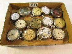 A tray of old pocket watches for spare or repair.