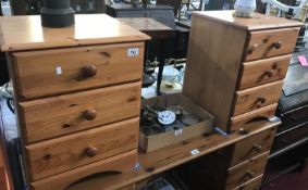 A pair of pine bedside chest of drawers