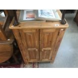 A solid pine 2 door cupboard