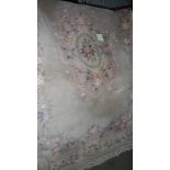 A pink wool carpet, 6' x 9'.