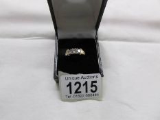 An 18ct gold ring set 3 diamonds, size M..