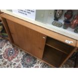 A 1960's teak 2 sliding door cupboard