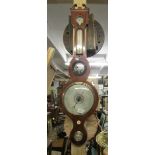 A mahogany inlaid barometer/thermometer.