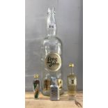 A large long john whiskey bottle and 3 miniature alcohol bottles