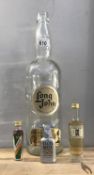 A large long john whiskey bottle and 3 miniature alcohol bottles