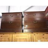 A pair of bedside drawers