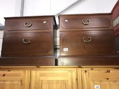 A pair of bedside drawers